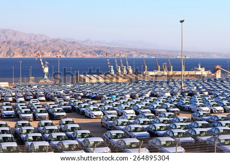EILAT, ISRAEL - MARCH 17, 2015 : Cargo port and new cars. Eilat port is located on the coast of the Red Sea gulf opposite to Jordan\'s cargo port. Red sea, Eilat, Israel  on March 17, 2015