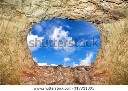 Cave view of blue sky. Magic world of the underground caves
