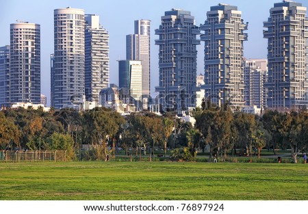 Football ground on the skyscrapers of Tel Aviv background (Israel)