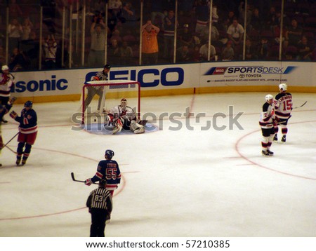 NEW YORK - OCTOBER 2: The Rangers score a goal on Devils goalie Martin Brodeur  in a preseason game at Madison Square Garden October 2, 2005 in New York, NY.