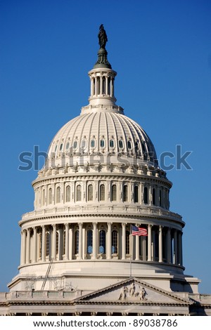 The bronze Statue of Freedom stands atop the cast iron dome of the United States Capitol building in Washington, D.C.  The dome was designed by Thomas U. Walter and the statue by Thomas Crawford.
