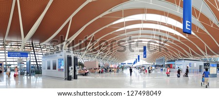 SHANGHAI, CHINA - MAY 27: Pudong Airport interior on May 27, 2012 in Shanghai, China. Pudong airport is the busiest international hub of mainland China, third busiest by cargo traffic in the world.