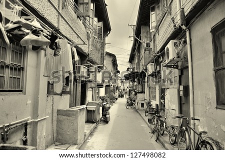 Old street in Shanghai with residential buildings in black and white