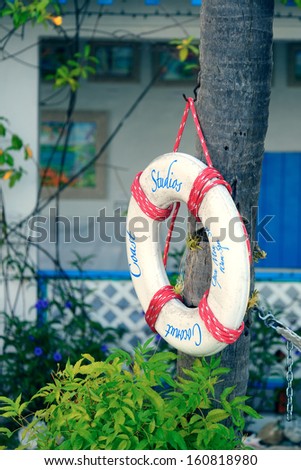 ST JOHN, VIRGIN ISLANDS - JAN 10: Lifebuoy in front of house on January 10, 2013 in St John, Virgin Islands. St. John is famous for its well-preserved natural beauty and attractive beaches