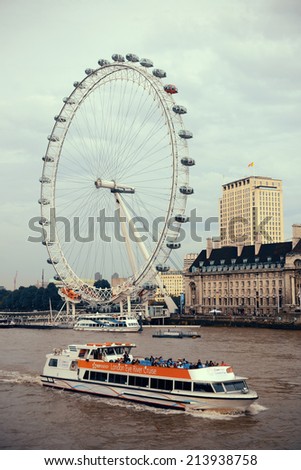 LONDON, UK - SEP 26: London Eye over Thames River on September 26, 2013 in London, UK. It is Europe's tallest Ferris wheel and the most popular paid tourist attraction in UK
