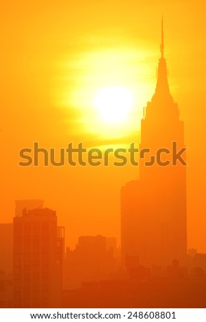 NEW YORK CITY, NY - JUL 11: Empire State Building at sunrise on July 11, 2014 in New York City. It is a 102-story landmark and was world\'s tallest building for more than 40 years.