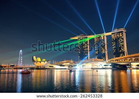 SINGAPORE - APR 5: Marina Bay Sands hotel light show at night on April 5, 2014 in Singapore. It is the world\'s most expensive building with cost of US$ 4.7 billion and landmark of Singapore.