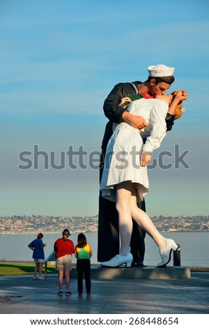 San Diego, CA - MAY 18: Unconditional Surrender sculpture at sea port on May 18, 2014 in San Diego. By Seward Johnson, the statue resembles the photograph of VJ day in Times Square