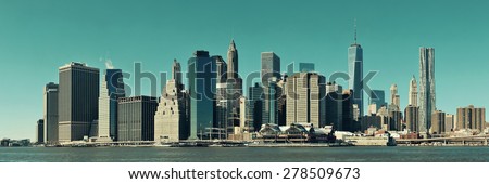 Manhattan financial district with skyscrapers over East River.