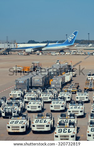 TOKYO, JAPAN - MAY 15: Airplane loading cargo at Narita airport on May 15, 2013 in Tokyo. Tokyo is the capital of Japan and the most populous metropolitan area in the world