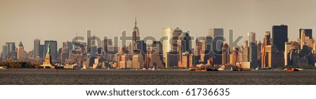 New York City Manhattan skyline panorama with Empire State Building and Statue of Liberty over Hudson River