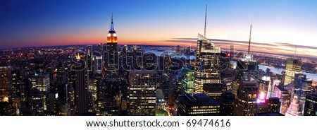 New York City Manhattan skyline panorama aerial view with Empire State Building and Times Square at sunset.