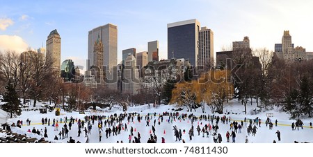 NEW YORK CITY, NY - JAN 1: People skate on ice with white Christmas in Central Park to welcome the new year of 2010 on January 1, 2011 in Manhattan, New York City.