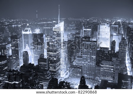 New York City Manhattan Times Square skyline aerial view panorama at night with skyscrapers and street.
