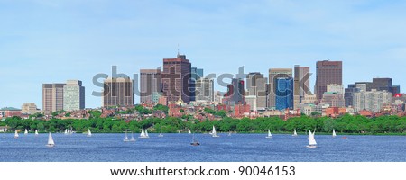 Boston Charles River panorama with urban skyline skyscrapers and sailing boat.