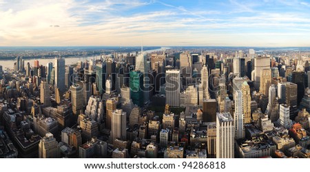 Urban city sunset panorama aerial view. New York City Manhattan aerial panorama view with New Jersey from west Hudson River and skyscrapers at sunset.