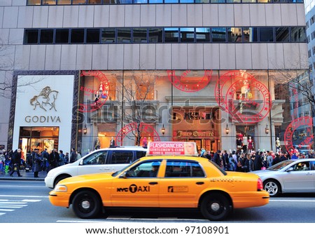 NEW YORK CITY, NY - DEC 30: Busy traffic on street on December 30, 2011 in New York City. Fifth Avenue has the world's most expensive retail spaces as the symbol of wealthy New York.