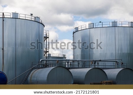 Overground thermal insulated cylindrical storage facilities for bitumen. Bitumen is a residual material used for asphalt production. Stock foto © 