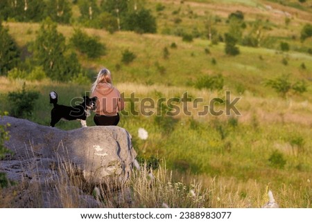Similar – Image, Stock Photo Rear view blonde woman walking in the evening on field, low sun