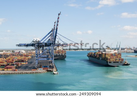 Port of Freeport Bahamas Container shipyard with heavy lifting Cranes and a ship waiting to off load its cargo