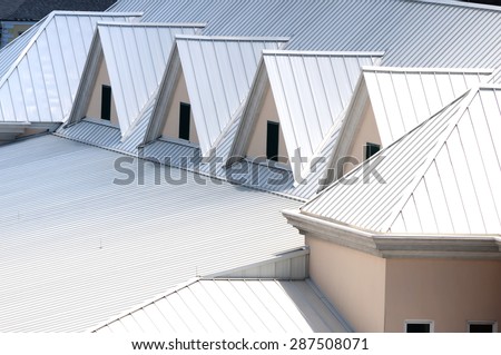 Unique white triangular shaped aluminum metal roof designed for maximum rain repulsion and heat reflection