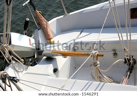 Tiller and other equipment in a sailing vessel.