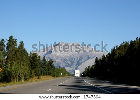 RV travelling through the mountains at Banff National Park, Alberta