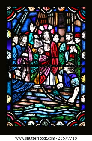 An old stained glass window featuring Jesus and the disciples in what looks to be a boat on water.