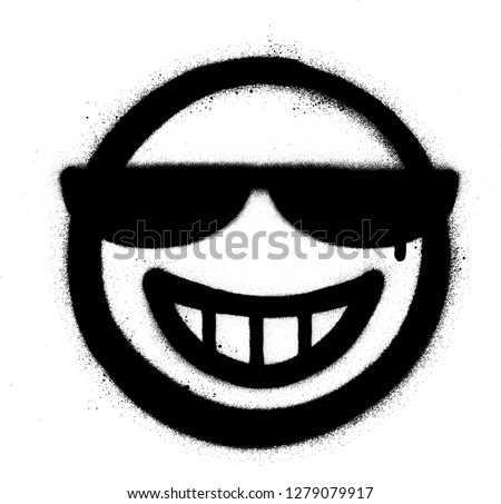 graffiti grin icon with sunglasses sprayed in black over white