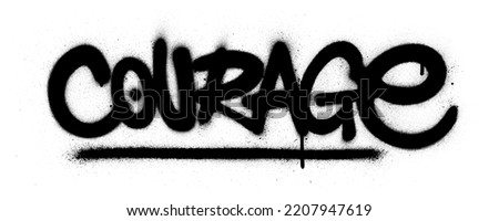 graffiti courage word sprayed in black over white