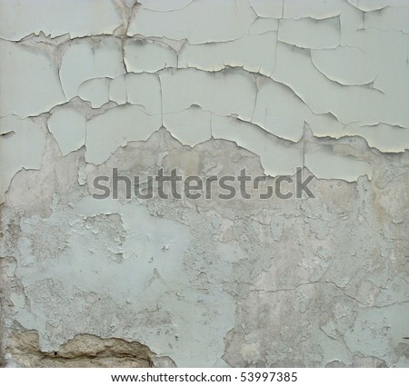 worn gray white light green painted wall with paint chip crack and blathering