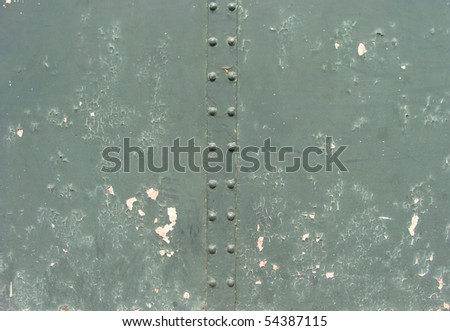 detail of a mint green metal gate door