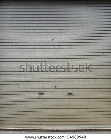worn metal garage door gate store roller shutter