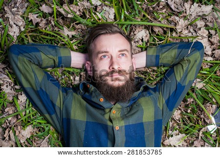 men hipster beard  lumber jack wood forest axe