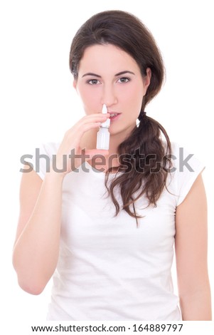 attractive young woman using nasal spray isolated on white background
