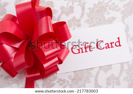 gift box with big red bow and gift card