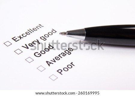survey with excellent, very good, good, average and poor answers and metal pen