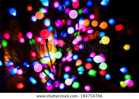 Colorful light bulbs and vivid round bokeh lights tree festive mood lightning