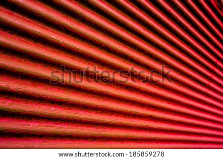 Retro old rusty vivid red metal shutter door horizontal lines in perspective view, background image