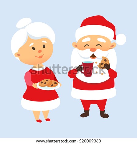 Santa Claus eating a cookies and drinking milk with his wife. Mrs. Santa treat and feed husbant cookies. Xmas tradition. Cute family couple. Mother and Father Christmas