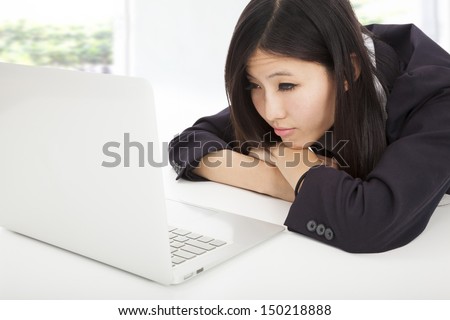 tired  business woman with laptop in  office