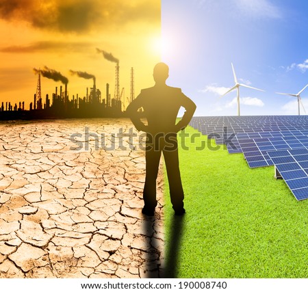 pollution and clean energy concept. businessman watching windmills solar panels and refinery with air pollution