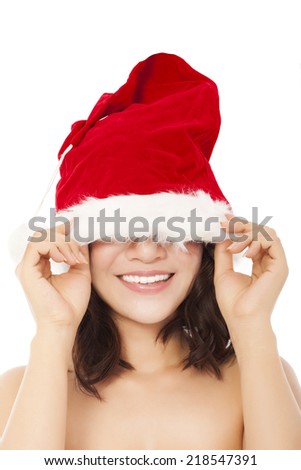 young christmas woman using santa cap to cover eyes. isolated on white background