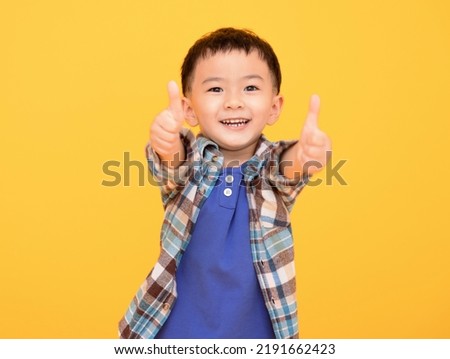 Similar – Image, Stock Photo little boy stands at the fence in front of two curious and hungry goats and shows his empty hands