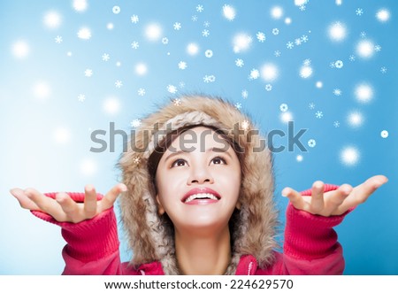 happy young woman watching snow