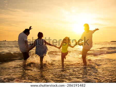 happy family enjoy summer vacation on the beach