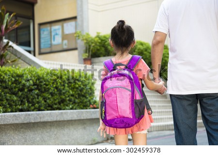 Father Walking To School With Children