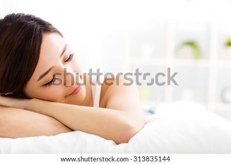 beautiful young  woman  sleep on the bed