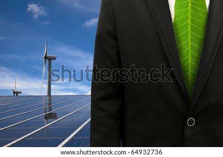 Green Business and eco energy.businessman with leaf tie and solar panel and windmill