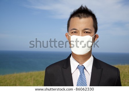 Businessman in depression with mask